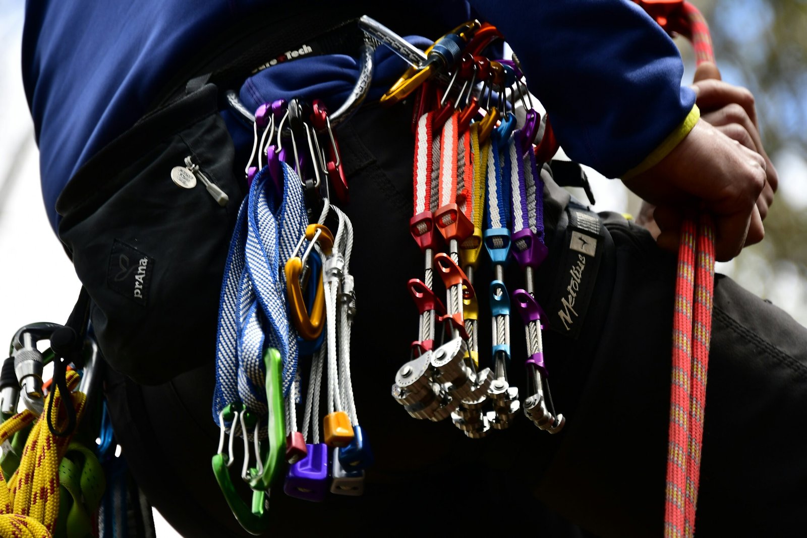 a person holding a bunch of skis and ski poles